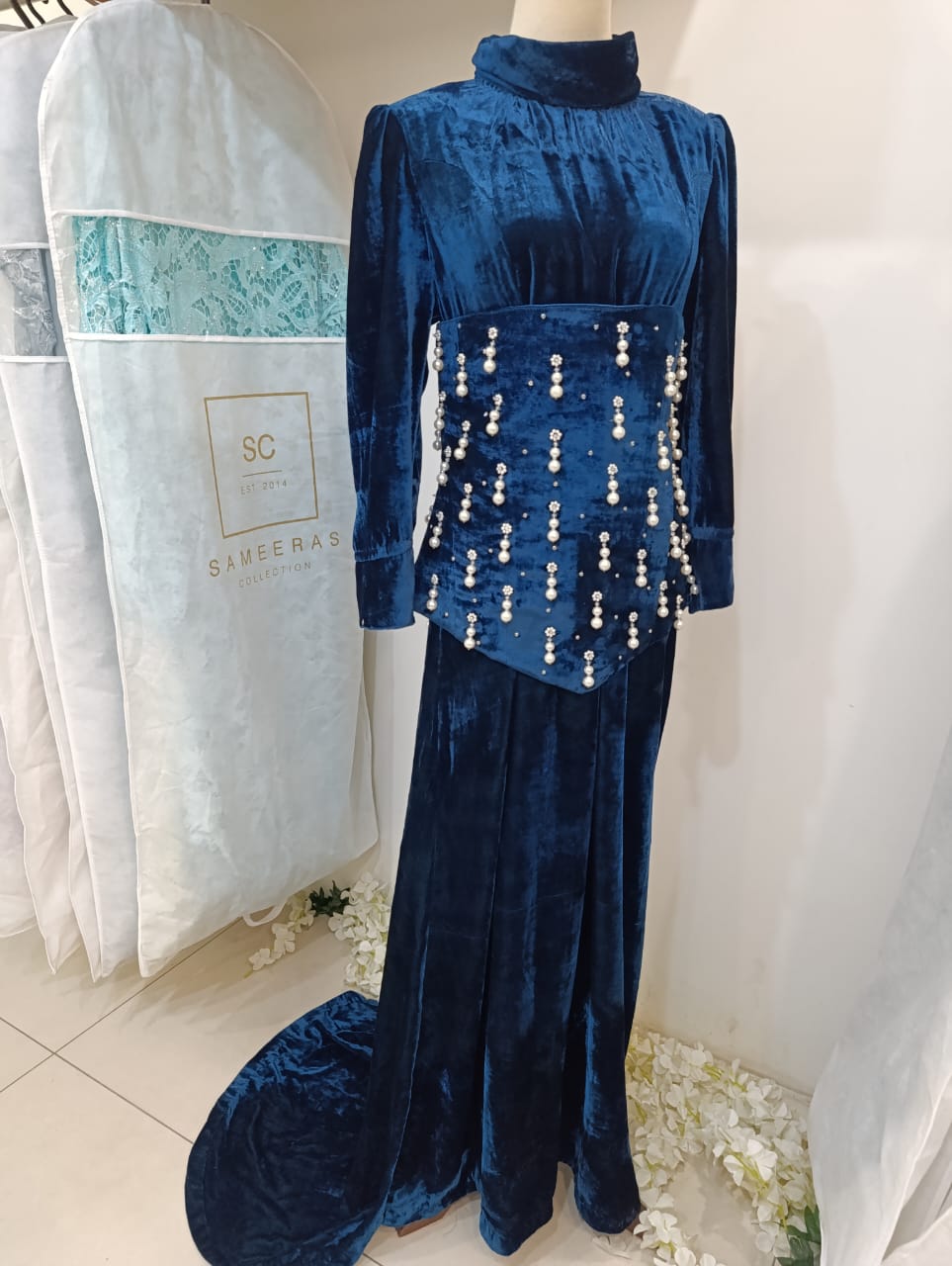 Navy velvet party dress with pearl embellishment